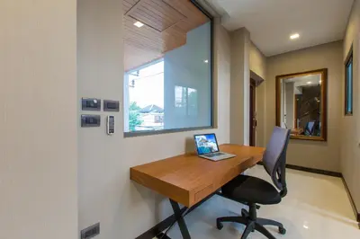 an office with a desk with a laptop on it at Aqua A1 in Rawai Beach