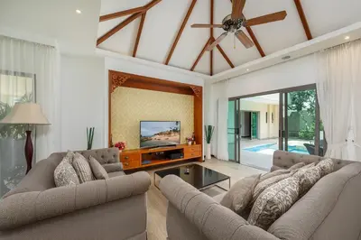 a living room with two couches and a flat screen tv at Villa Bond 3BR Private Pool Near Naiharn Beach in Rawai Beach