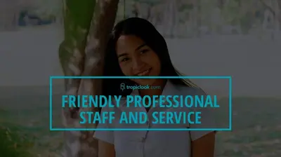 a woman standing next to a tree with the words friendly professional staff and service at Villa Bond 3BR Private Pool Near Naiharn Beach in Rawai Beach