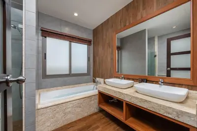 a bathroom with two sinks and a tub and a mirror at Villa Bond 3BR Private Pool Near Naiharn Beach in Rawai Beach