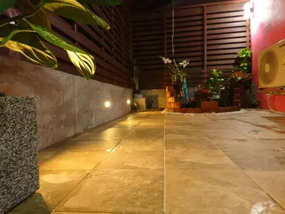 an empty hallway with plants in a building at 65 Pradit in Nai Yang Beach