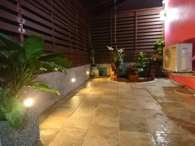 a hallway with potted plants in a room at 65 Pradit in Nai Yang Beach