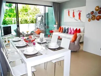 a living room with a white table and chairs at COCO Chalong 2 bedrooms New Villa in Chalong