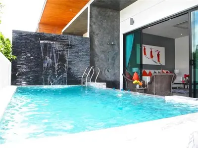 a swimming pool in the middle of a house at COCO Chalong 2 bedrooms New Villa in Chalong