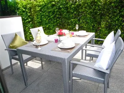 a gray table with chairs and plates on it at COCO Chalong 2 bedrooms New Villa in Chalong
