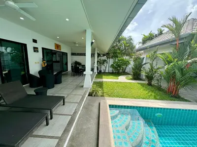 a house with a swimming pool next to a house at Gabriel Villa by G Estate in Rawai Beach