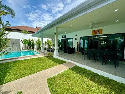 a house with a patio and a swimming pool at Gabriel Villa by G Estate in Rawai Beach