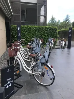 a group of bikes parked outside of a building at Baan Mai Khao in Mai Khao Beach