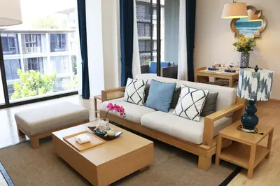 a living room with a couch and a table at Baan Mai Khao in Mai Khao Beach
