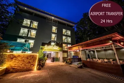 a building with a sign that reads nonprofit transfer hrs at Naiyang Place - Phuket Airport in Nai Yang Beach