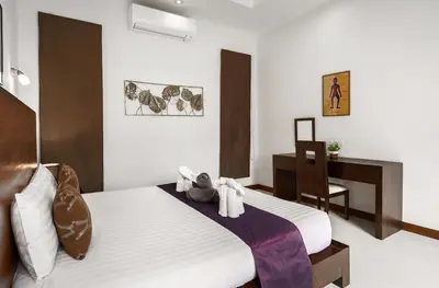 a bedroom with a bed with towels on it at Emotion 2 Villa by G Estate in Rawai Beach