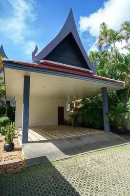 a small house with a roof on a patio at La Romanee Infinity by G Estate in Rawai Beach