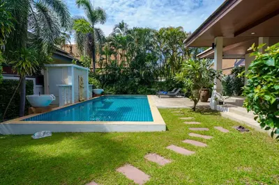 a swimming pool in the yard of a house at Corton Villa by G Estate in Rawai Beach