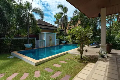 a swimming pool in the yard of a house at Corton Villa by G Estate in Rawai Beach