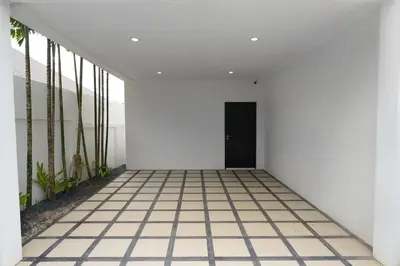 an empty hallway with white walls and a black door at Clos Vougeot Villa by G Estate in Rawai Beach