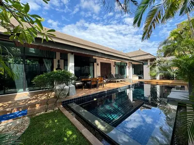 a swimming pool in the backyard of a house at Emotion 1 Villa by G Estate in Rawai Beach