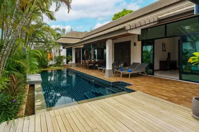 an external view of a house with a swimming pool at Emotion 1 Villa by G Estate in Rawai Beach