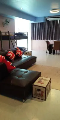 a living room with a couch and a bunk bed at Phuket Wake Park in Kathu