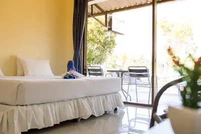 a child laying on a bed in a room at Phuket Wake Park in Kathu