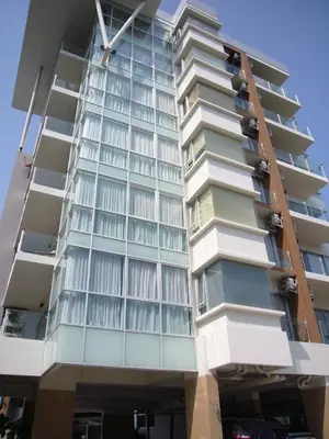 a tall building with lots of windows at Chic Condominium Unit A303, A306, A307, A308, A406 in Karon Beach