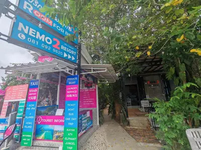 a store with signs on the front of it at Nemo 2 Resort in Ao Nang Beach