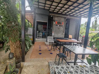 a patio with tables and chairs and a restaurant at Nemo 2 Resort in Ao Nang Beach