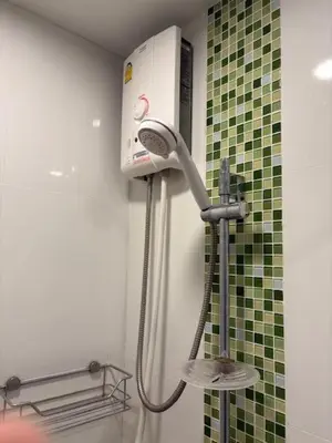 a shower in a bathroom with a blow dryer at Risa Plus2 in Kathu