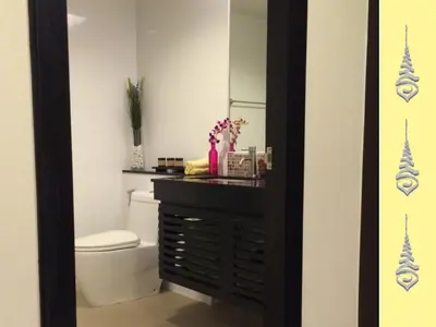 a bathroom with a toilet and a vanity with a mirror at Apt S104 Kamala Regent in Kamala Beach