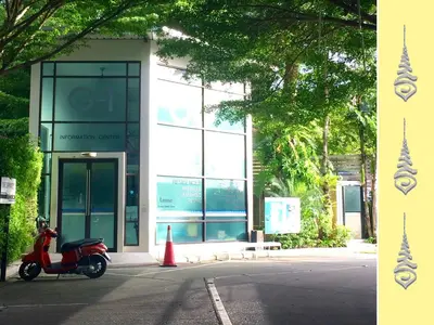 a scooter parked in front of a building at Apt S104 Kamala Regent in Kamala Beach