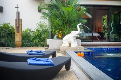 a pool with a statue of an elephant and a fountain at VILLA PAGAI Pool Baan Bua Estate Naiharn in Rawai Beach
