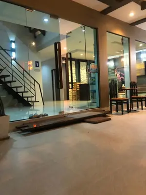 a building with glass windows and a staircase in it at S2 Residence in Ao Nang Beach