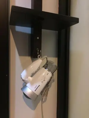 a white phone is hanging on a wall at S2 Residence in Ao Nang Beach