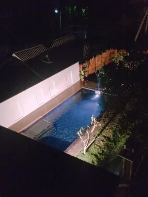 an overhead view of a swimming pool at night at S2 Residence in Ao Nang Beach