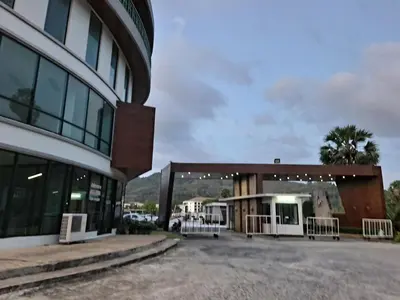 a building with a parking lot in front of it at The Naithorn Condo Unit 401 in Nai Thon Beach