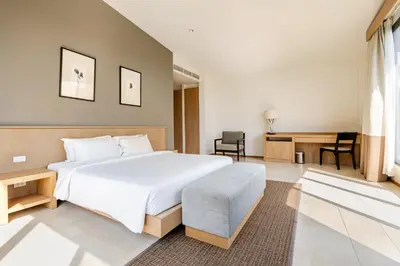 a bedroom with a large white bed and a desk at CASABAY Luxury Pool Villas by STAY in Rawai Beach