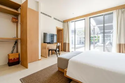 a bedroom with a bed and a large window at CASABAY Luxury Pool Villas by STAY in Rawai Beach