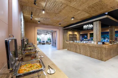 a buffet line with food in a restaurant at Amala Grand Bleu Resort Hilltops - SHA in Kamala Beach