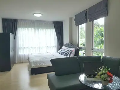 a bedroom with a bed and a couch and a table at Dcondo Kathu Patong Phuket by Jack in Kathu