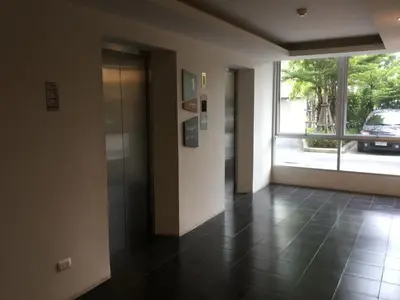 an empty hallway with a door and a window at Dcondo Kathu Patong Phuket by Jack in Kathu