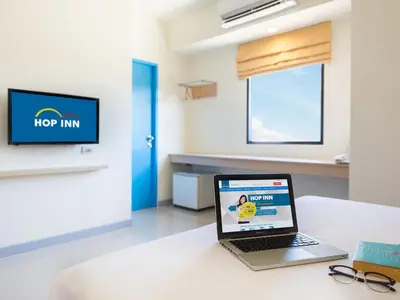 a laptop sitting on a table in a hospital room at HOP INN Phuket in Phuket Town