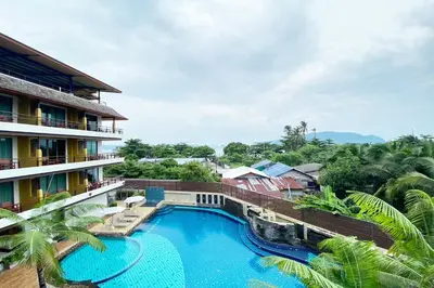 an aerial view of a resort with a swimming pool at Aqua Resort Phuket - Near Beach and Chalong Pier in Rawai Beach