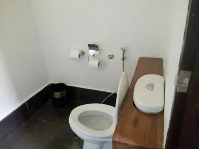 a bathroom with a toilet and two rolls of toilet paper at Tukonnee Villas Koh Yao Noi in Ko Yao Noi