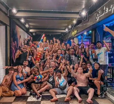 a group of people posing for a picture at a party at Balcony Party Hostel - 18-40 in Ao Nang Beach