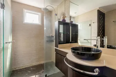 a bathroom with a black sink and a shower at Andaman Sea View Apartment - Patong Beach in Patong Beach