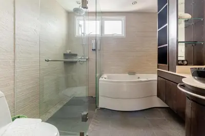 a bathroom with a tub and a toilet and a sink at Andaman Sea View Apartment - Patong Beach in Patong Beach