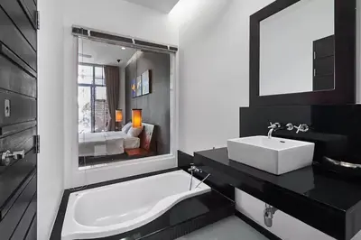 a bathroom with a sink and a tub and a mirror at Villa Oxygen - Bangtao Beach in Bang Tao Beach