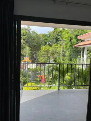 a view from a window of a balcony at Lotus Bleu Resort & Restaurant in Rawai Beach