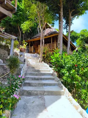 a set of stairs leading to a house at Phi Phi Phu Chalet Resort in Phi Phi Don