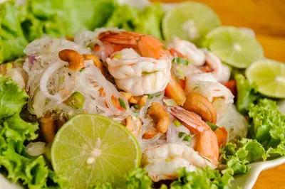a salad with shrimp and lettuce and lime slices at Phi Phi Phu Chalet Resort in Phi Phi Don
