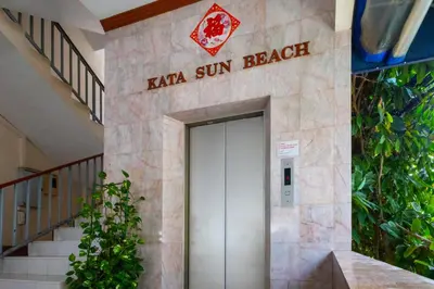 a building with a sign that reads kaya sun beeper at Kata Sun Beach Hotel in Kata Beach